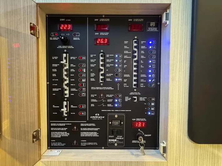  Yacht Photos Pics Electrical control panel of a 2017 Cranchi E 52 F yacht, displaying various switches and indicators.