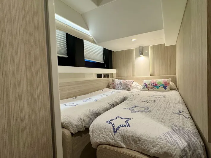  Yacht Photos Pics 2017 Cranchi E 52 F yacht cabin with twin beds and modern decor.