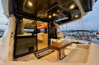 Luxurious 2017 Cranchi E 52 F yacht interior with elegant seating and modern lighting.