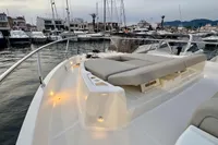 2017 Cranchi E 52 F yacht docked at marina, featuring spacious deck and modern design.