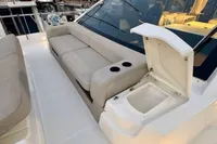 Luxurious seating area on 2017 Cranchi E 52 F yacht with built-in cup holders.