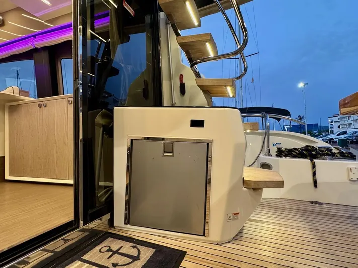  Yacht Photos Pics Cranchi E 52 F 2017 yacht interior with wooden stairs and modern design elements.