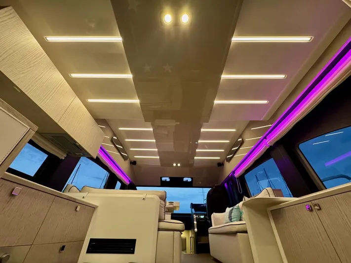  Yacht Photos Pics Luxurious interior of 2017 Cranchi E 52 F yacht with modern lighting and seating.