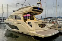 2017 Cranchi E 52 F yacht docked at marina, showcasing sleek design and modern features.