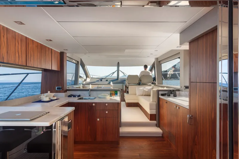 M/y Lady K Yacht Photos Pics Luxurious interior of 2018 Sunseeker Manhattan 52 yacht with modern kitchen and seating area.