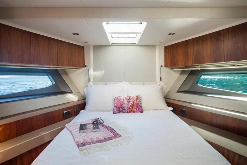 M/y Lady K Yacht Photos Pics Luxurious cabin interior of 2018 Sunseeker Manhattan 52 yacht with elegant bedding.