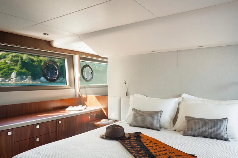 M/y Lady K Yacht Photos Pics Luxurious bedroom interior of 2018 Sunseeker Manhattan 52 yacht with elegant decor.