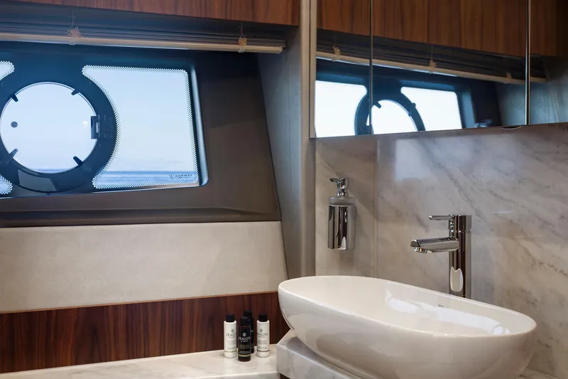 M/y Lady K Yacht Photos Pics Luxurious bathroom interior of 2018 Sunseeker Manhattan 52 yacht with modern fixtures.