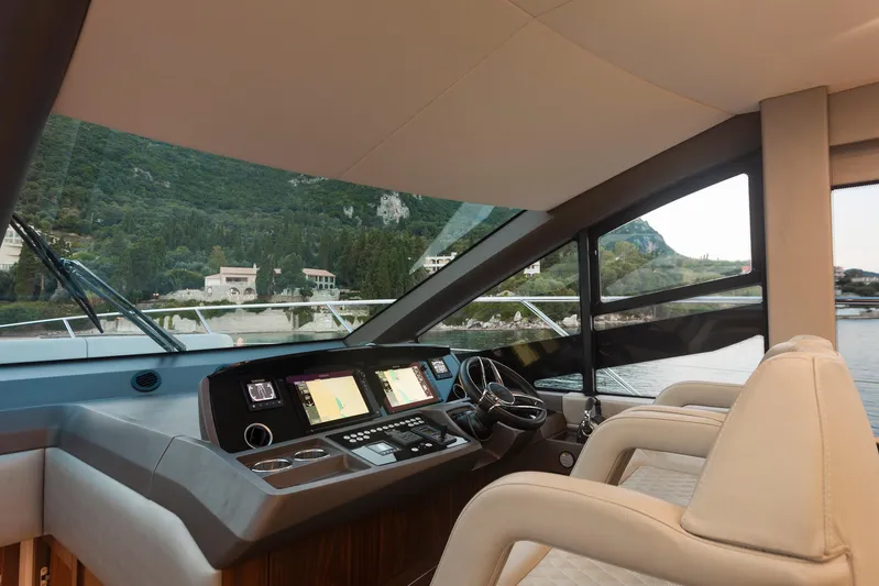 M/y Lady K Yacht Photos Pics Interior view of 2018 Sunseeker Manhattan 52 yacht cockpit with modern navigation equipment.