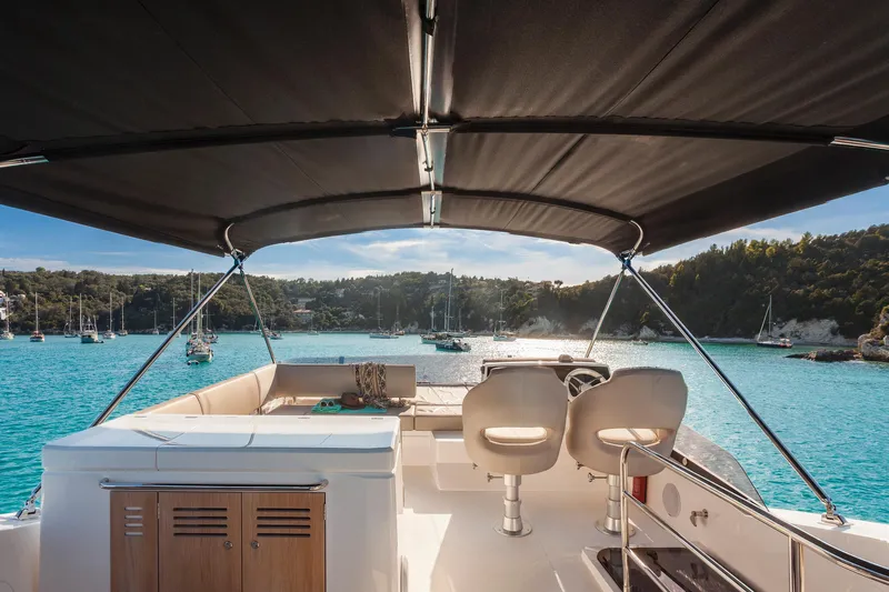 M/y Lady K Yacht Photos Pics 2018 Sunseeker Manhattan 52 yacht interior with ocean view and canopy.