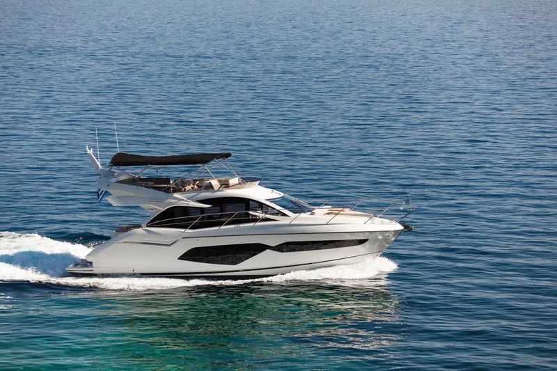 M/y Lady K Yacht Photos Pics 2018 Sunseeker Manhattan 52 yacht cruising on open water.