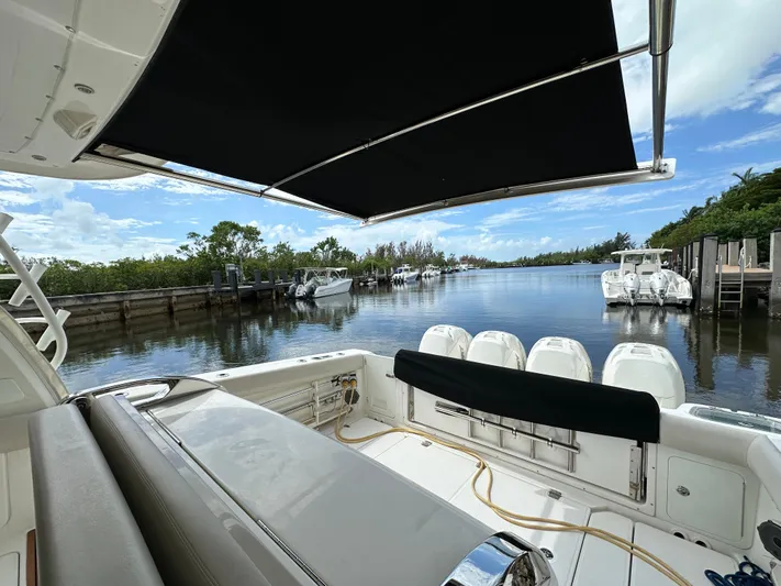  Yacht Photos Pics 2020 Boston Whaler 420 Outrage boat docked in serene marina setting.