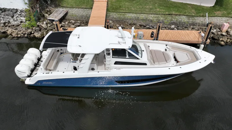  Yacht Photos Pics 2020 Boston Whaler 420 Outrage boat docked on calm water.