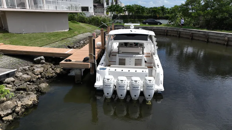  Yacht Photos Pics Boston Whaler 420 Outrage 2020 docked with four powerful outboard engines.