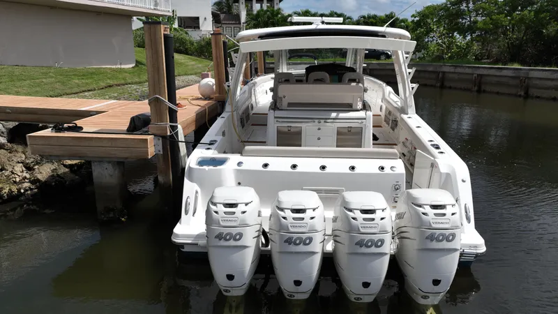  Yacht Photos Pics 2020 Boston Whaler 420 Outrage with quad 400 engines docked in a marina.