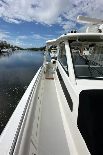  Yacht Photos Pics 2020 Boston Whaler 420 Outrage boat on calm water under blue sky.