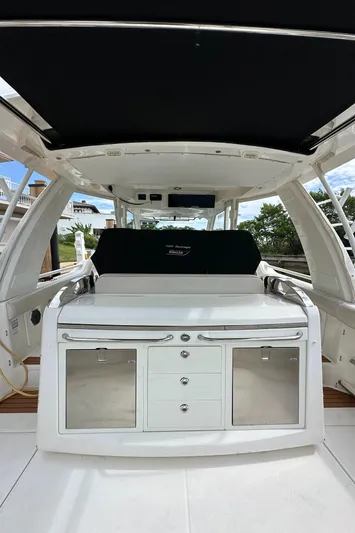  Yacht Photos Pics 2020 Boston Whaler 420 Outrage interior with sleek cabinetry and modern design.