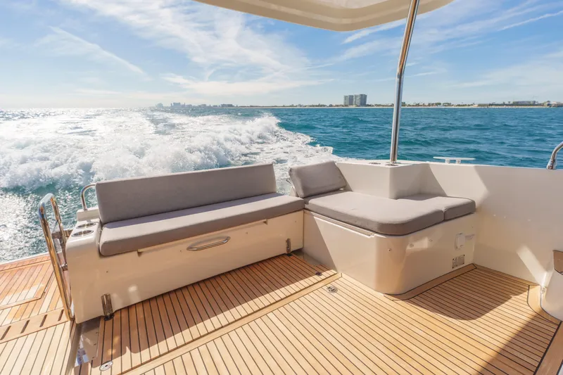 Carolina Blues Yacht Photos Pics 2025 Beneteau Swift Trawler 41 Fly cruising on open water, featuring elegant deck seating.