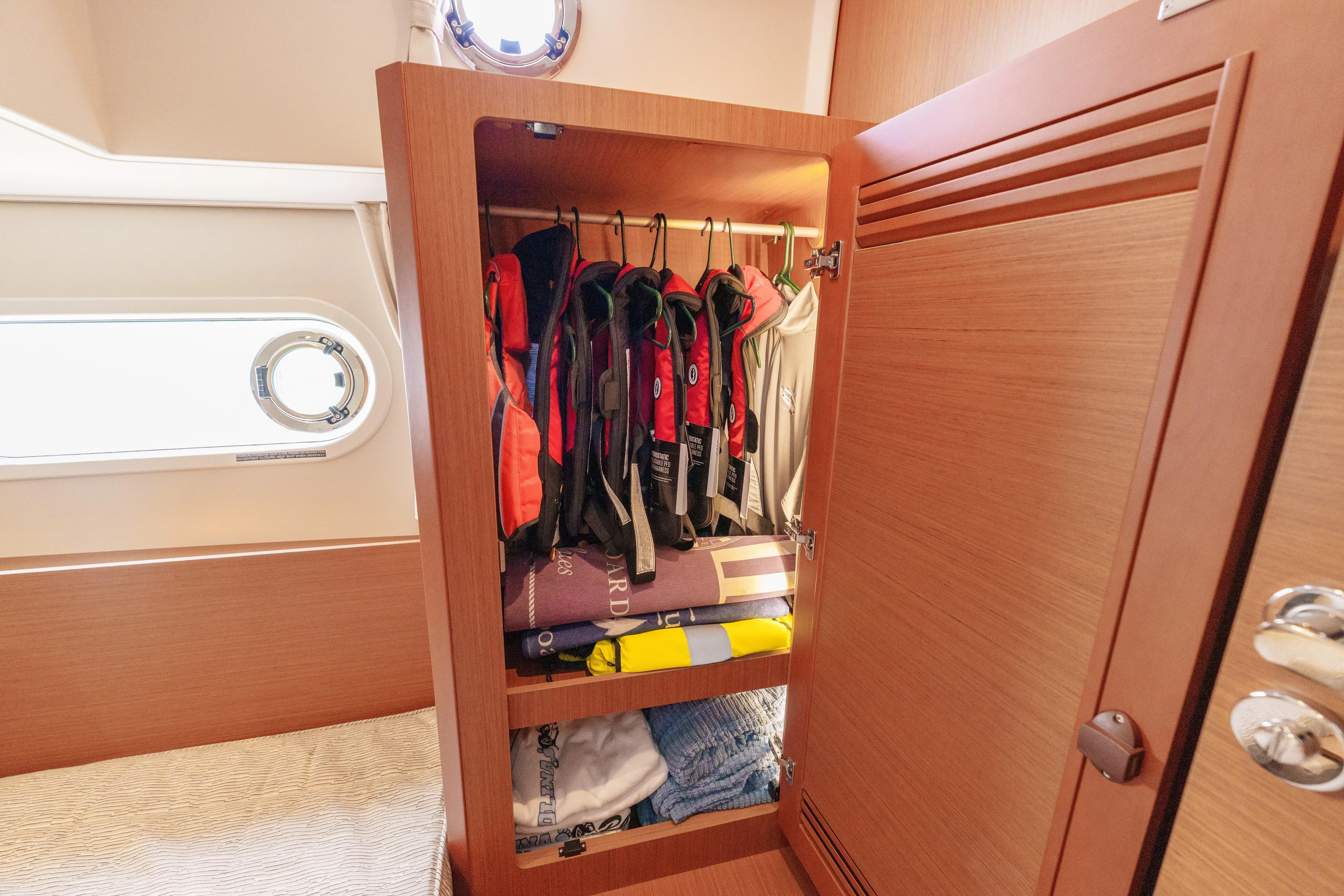 Carolina Blues Yacht Photos Pics 2025 Beneteau Swift Trawler 41 Fly interior closet with life jackets and linens.