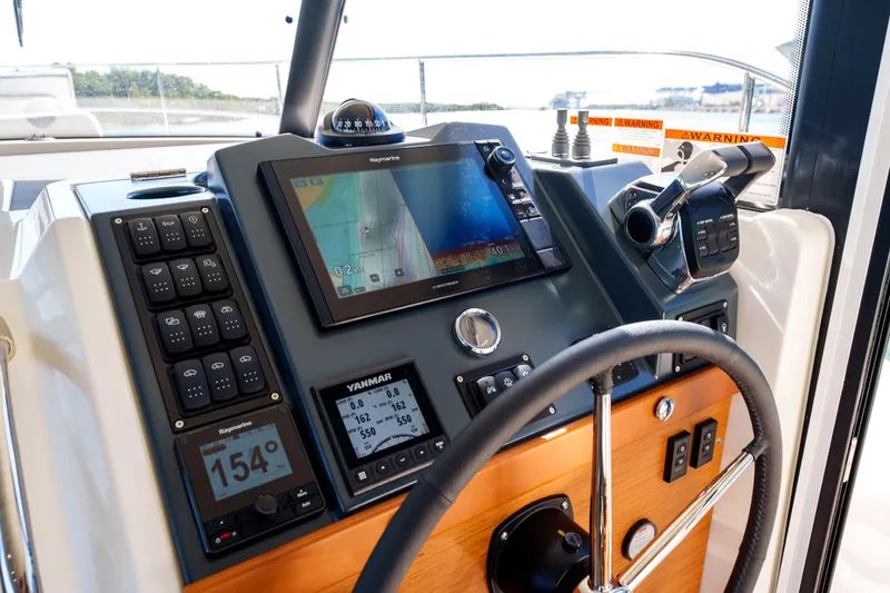 Carolina Blues Yacht Photos Pics Helm of 2025 Beneteau Swift Trawler 41 Fly with navigation controls and display.