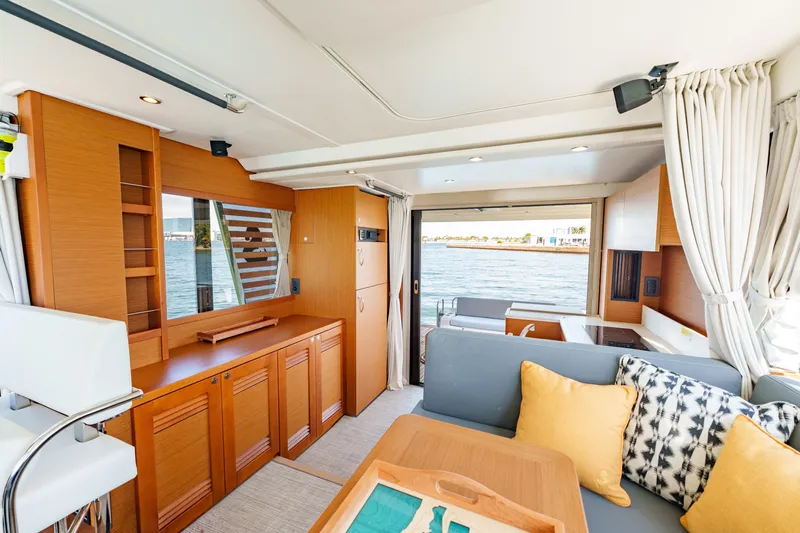 Carolina Blues Yacht Photos Pics Luxurious interior of 2025 Beneteau Swift Trawler 41 Fly with elegant wood finishes.