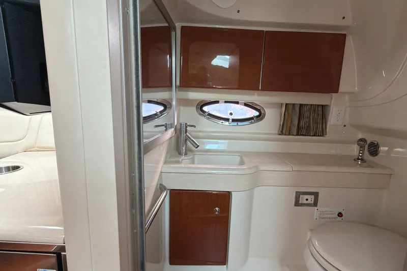  Yacht Photos Pics Interior of 2009 Formula 350 Sun Sport boat bathroom with sink and toilet.