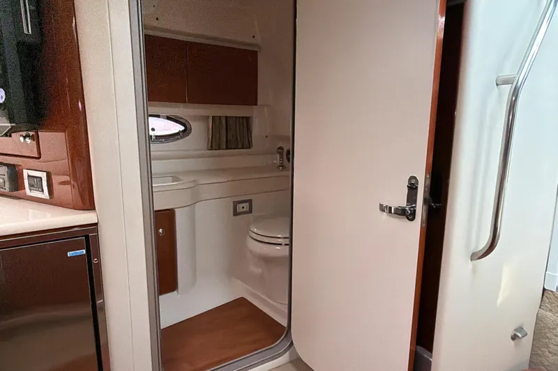  Yacht Photos Pics 2009 Formula 350 Sun Sport boat interior bathroom with modern amenities and wooden accents.