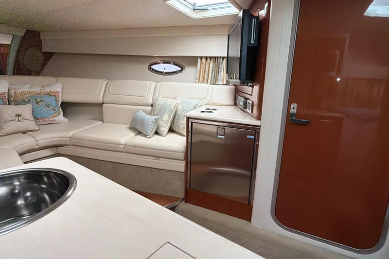  Yacht Photos Pics Interior of a 2009 Formula 350 Sun Sport boat with seating and kitchenette.