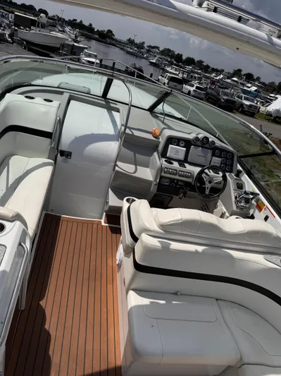  Yacht Photos Pics 2009 Formula 350ss boat interior with white seating and control panel at marina.