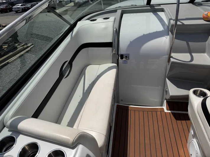  Yacht Photos Pics 2009 Formula 350SS boat interior with white seating and wood flooring.