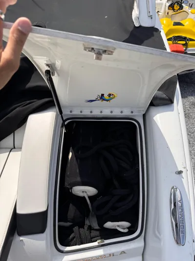  Yacht Photos Pics Open storage compartment on a 2009 Formula 350ss boat, containing ropes and accessories.