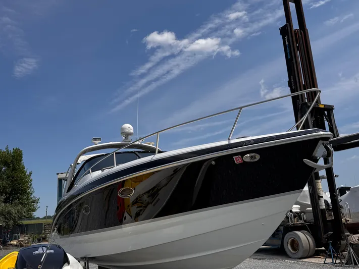 Yacht Photos Pics 2009 Formula 350ss boat on dry dock under clear blue sky.