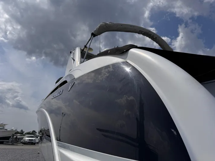  Yacht Photos Pics 2009 Formula 350ss boat with sleek design under cloudy sky.