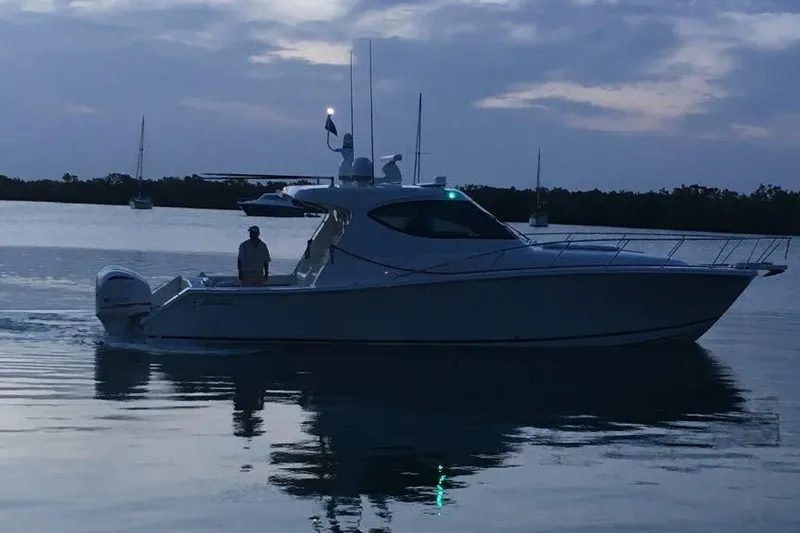  Yacht Photos Pics 2015 Jupiter 41 SB boat cruising at dusk on calm waters.