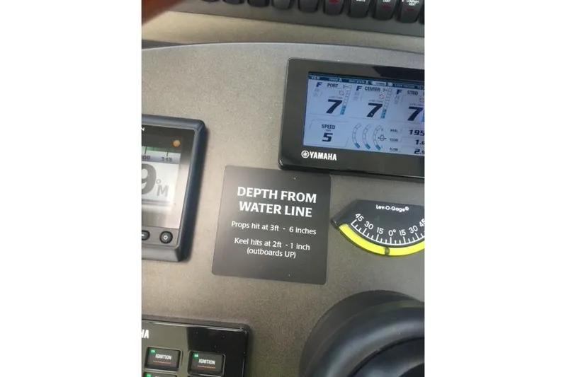  Yacht Photos Pics Control panel of 2015 Jupiter 41 SB boat with depth and speed gauges.