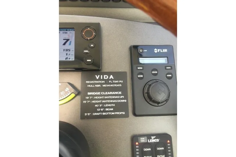  Yacht Photos Pics Control panel of a 2015 Jupiter 41 SB boat with registration details and specifications.