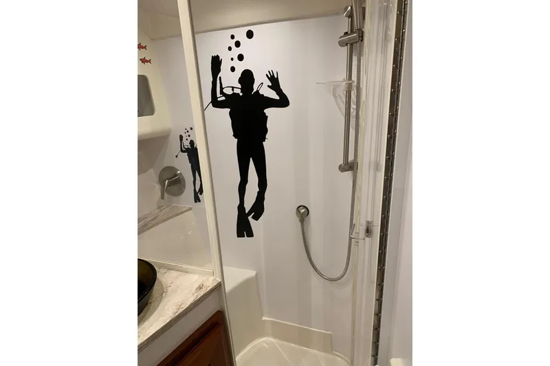  Yacht Photos Pics Shower area in 2015 Jupiter 41 SB boat with diver silhouette decor.