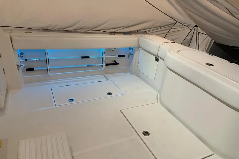  Yacht Photos Pics 2015 Jupiter 41 SB boat interior with white seating and storage compartments.