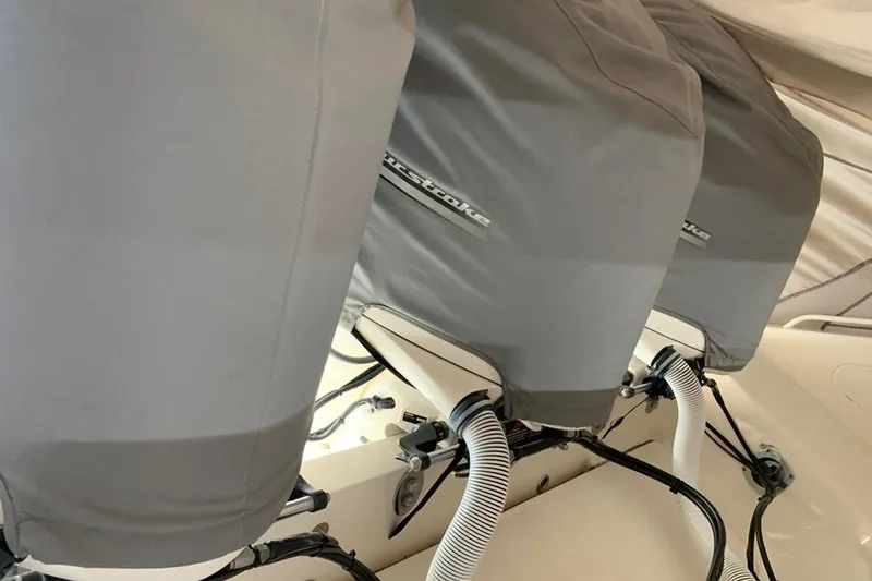  Yacht Photos Pics Three covered outboard motors on a 2015 Jupiter 41 SB boat.