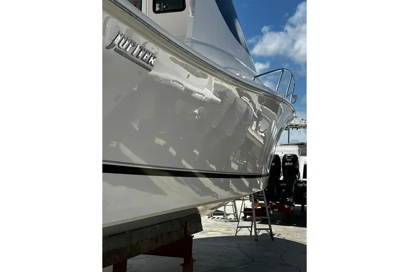  Yacht Photos Pics 2015 Jupiter 41 SB boat with sleek hull design under clear blue sky.