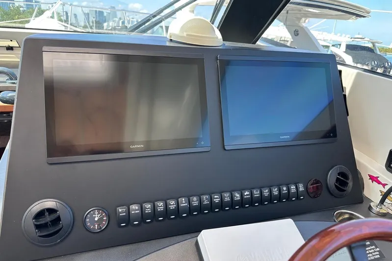 Yacht Photos Pics Control panel of a 2015 Jupiter 41 SB boat with dual Garmin displays.