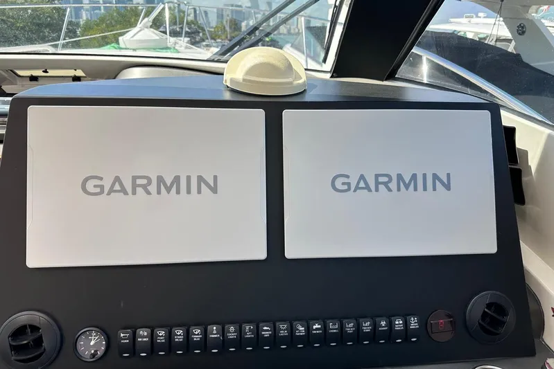  Yacht Photos Pics Dashboard of 2015 Jupiter 41 SB with dual Garmin displays and control panel.