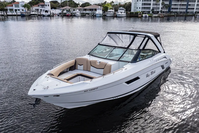  Yacht Photos Pics 2015 Cruisers Yachts 338 Bow Rider on calm water, showcasing sleek design and spacious seating.