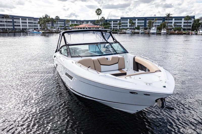  Yacht Photos Pics 2015 Cruisers Yachts 338 Bow Rider on water, with modern design and spacious seating.