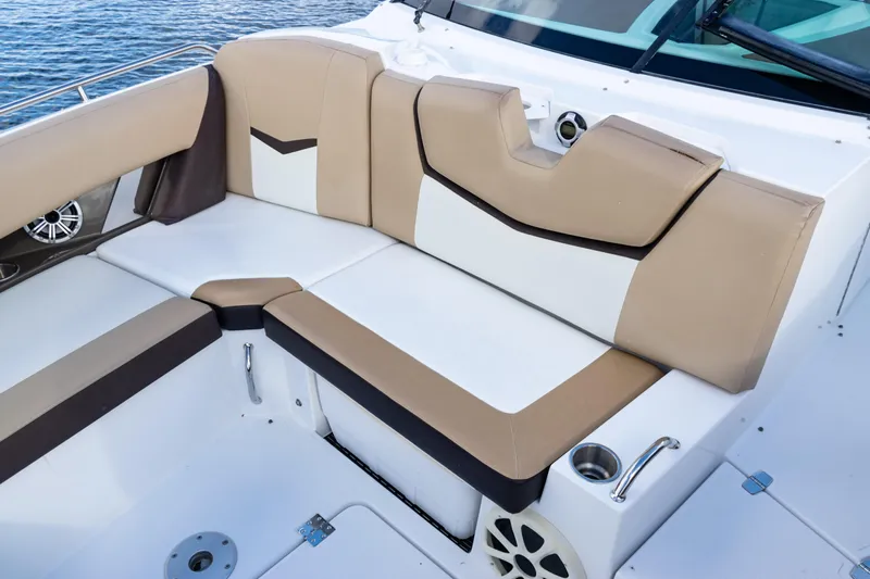  Yacht Photos Pics 2015 Cruisers Yachts 338 Bow Rider interior seating with beige and white upholstery.
