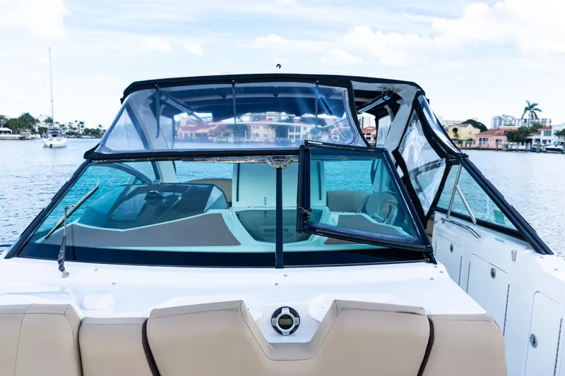  Yacht Photos Pics 2015 Cruisers Yachts 338 Bow Rider on water, showcasing sleek design and spacious interior.