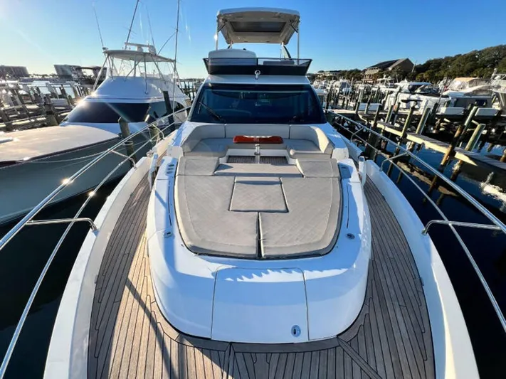 Blind Date Yacht Photos Pics 2020 Fairline Squadron 68 yacht docked at marina, showcasing spacious deck and sleek design.