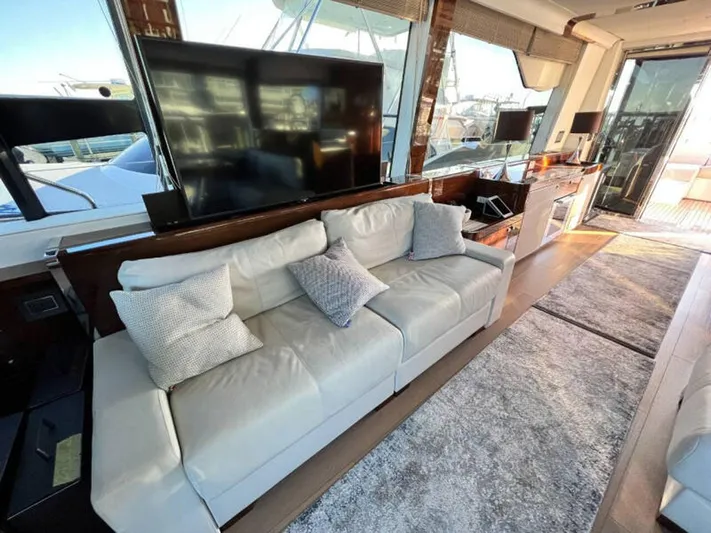 Blind Date Yacht Photos Pics Luxurious interior of 2020 Fairline Squadron 68 yacht with plush seating and modern decor.