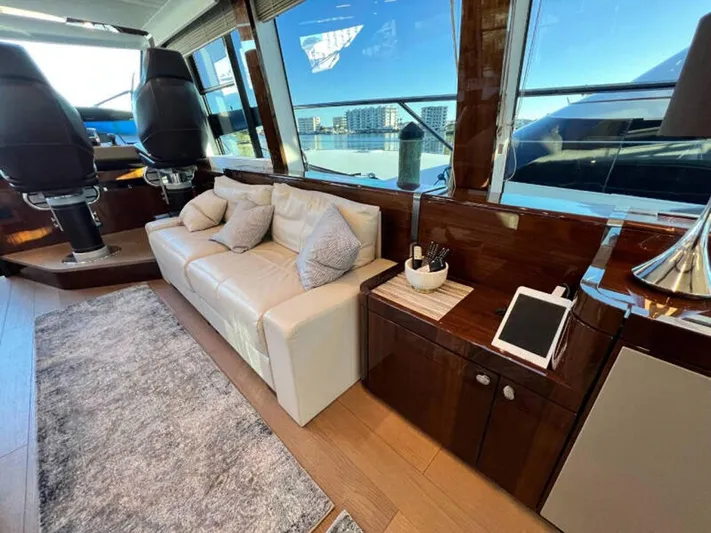 Blind Date Yacht Photos Pics Luxurious interior of 2020 Fairline Squadron 68 yacht with leather sofa and modern decor.