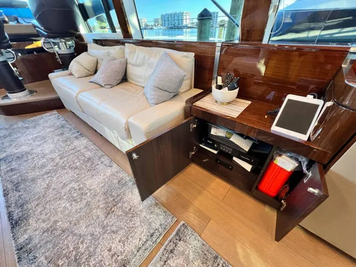 Blind Date Yacht Photos Pics Luxurious interior of 2020 Fairline Squadron 68 yacht with sofa and modern amenities.